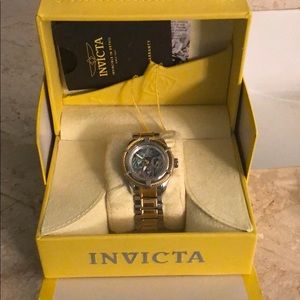 Ladies Invicta watch with mother of pearl face.